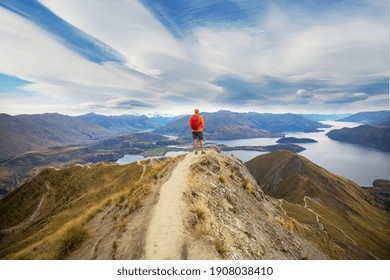 Traveler hiking in Roys Peak. New Zealand. Lake Wanaka