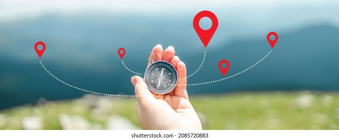 Traveler Holding Compass In Hand For Searching Direction Outdoor. Person Use Compass To Find Location. Mountain Progression Path.