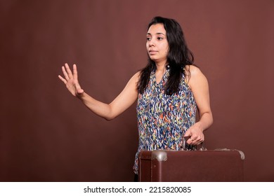 Traveler Holding Suitcase, Waiting For Taxi, Vacation. Indian Woman Standing With Leather Baggage, Waving For Car, Tourist Carrying Luggage, Going On Journey, Tourism Concept