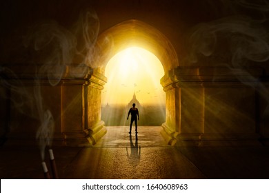 Traveler Inside A Buddhist Temple At Sunrise