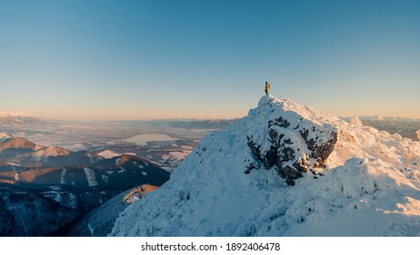 Traveler man climbing on mountain top adventure travel extreme healthy lifestyle vacations hiking outdoor success achievement brave hiker on the edge