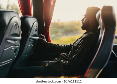 Traveler man traveling in intercity bus, look to the window
