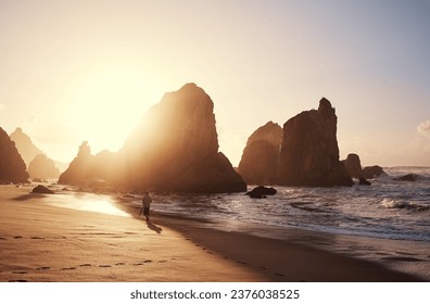 Traveler on beautiful Atlantic ocean beach on sunset time. - Powered by Shutterstock