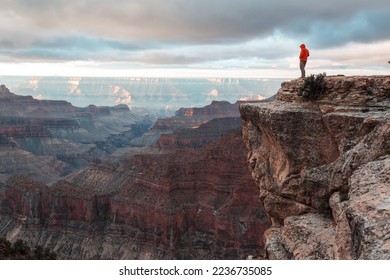 Traveler on cliff mountains over Grand Canyon National Park, Arizona, USA.Inspiring emotion. Travel Lifestyle journey success motivation concept adventure  vacations outdoor concept. - Powered by Shutterstock