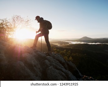 Traveler on mountain summit enjoying aerial view over misty countryside. Travel Lifestyle success adventur - Shutterstock ID 1243911925