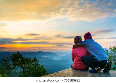 Traveler  relaxing on top of a hill and enjoying view of surise in mountains view, Traveling along mountains and coast, freedom and active lifestyle concept,copy space. - Powered by Shutterstock