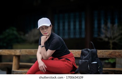 A Traveler Sat Down On A Stool To Rest.Tourist Portrait