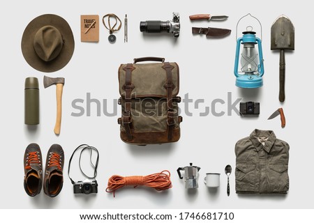 Traveler set on white background isolated. Packing backpack for a trip creative concept.