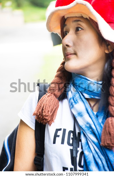 Traveler thai woman portrait and posing for take\
photo between travel\
Germany
