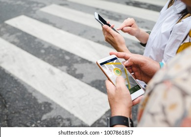 Traveler use map on mobile phone app to search for route location of place with gps on street when travel in city,Technology in lifestyle 