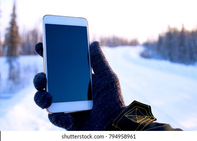 Traveler The Use Of The Phone In The Winter Forest