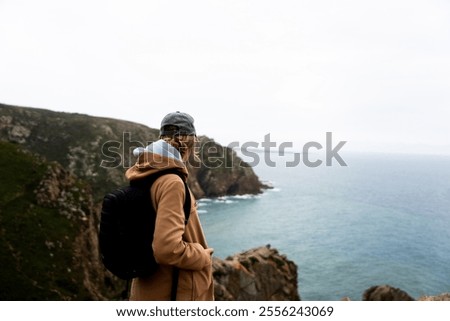 Similar – Image, Stock Photo Enjoy the view. Woman with headband, jacket. Ireland