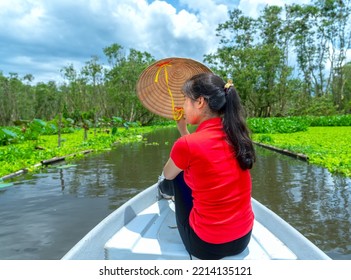 Traveler Woman On A Boat Tour Along The Canals In The Mangrove Forest. This Is An Eco Tourism Area At Mekong Delta In An Giang, Vietnam