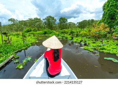 Traveler Woman On A Boat Tour Along The Canals In The Mangrove Forest. This Is An Eco Tourism Area At Mekong Delta In An Giang, Vietnam