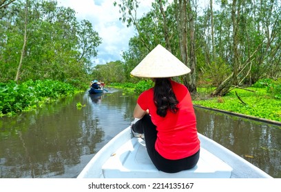 Traveler Woman On A Boat Tour Along The Canals In The Mangrove Forest. This Is An Eco Tourism Area At Mekong Delta In An Giang, Vietnam