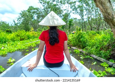 Traveler Woman On A Boat Tour Along The Canals In The Mangrove Forest. This Is An Eco Tourism Area At Mekong Delta In An Giang, Vietnam