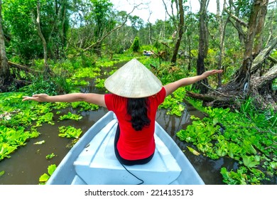 Traveler Woman On A Boat Tour Along The Canals In The Mangrove Forest. This Is An Eco Tourism Area At Mekong Delta In An Giang, Vietnam