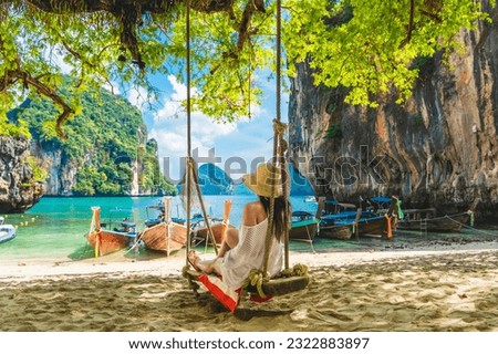 Traveler woman relaxing on swing joy nature scenic landscape Lao Lading beach island Krabi, Famous place tourist travel Phuket Thailand summer holiday vacation trip, Tourism beautiful destination Asia