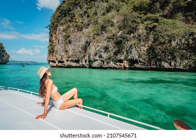 Traveler woman in swimsuit relaxing on boat looking beautiful natural Pileh lagoon Krabi, Water travel Phuket Thailand beach, Tourist girl on summer holiday vacation, Tourism destination Asia trip