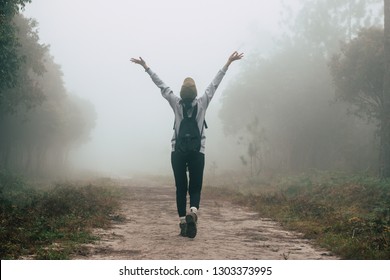 traveler women walking on road in the forest paths in the woods and foggy, hiker women enjoying the beautiful nature with fog
 - Powered by Shutterstock