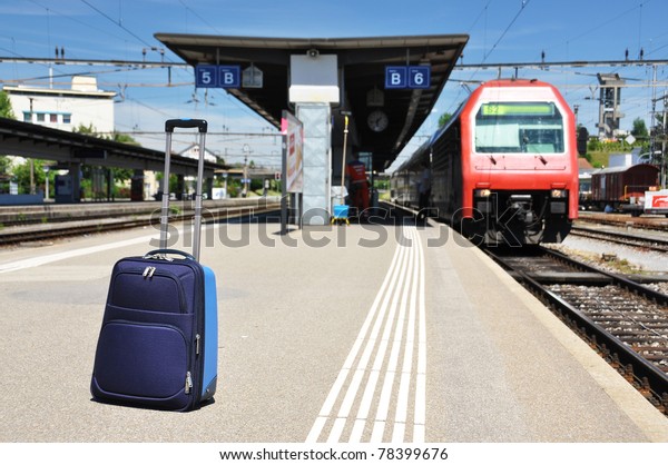 Traveler\'s bag at a train\
station