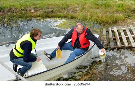 Travelers Bailing Out A Sinking Boat