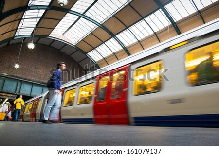 Travelers movement in tube train station, King Cross, London 