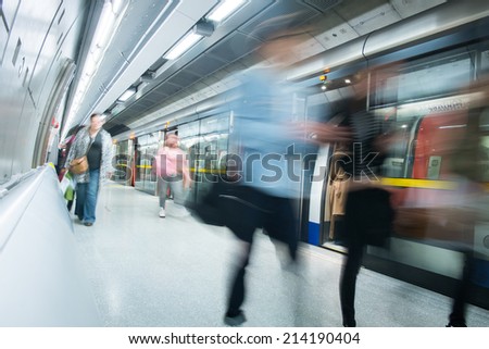 Travelers movement in tube train station, London