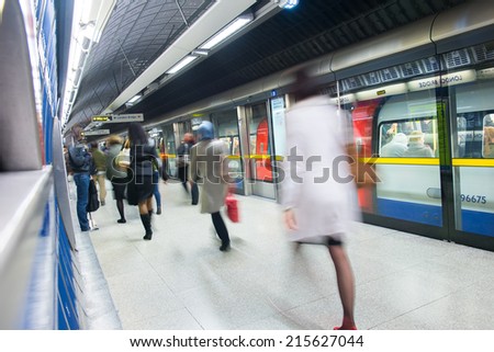 Travelers movement in tube train station, London