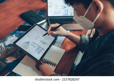 Travelers planning trips and use tablet to book hotels, buy plane tickets, search map, or find travel routes. Travel concept. - Powered by Shutterstock