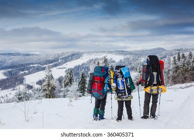 Travelers In Winter Mountains. Sport Lifestyle Travel Concept
