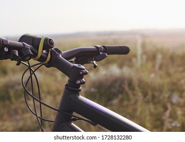 Traveling bike bicycle handlebars at sunset