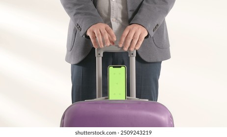 Traveling business man tourist with suitcase and smartphone chroma key green screen in international airport isolated on white background. Travel concept. - Powered by Shutterstock