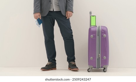 Traveling business man tourist with suitcase and smartphone chroma key green screen in international airport isolated on white background. Travel concept. - Powered by Shutterstock