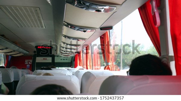 \
Traveling by bus on road. passenger back point of\
view back of bus