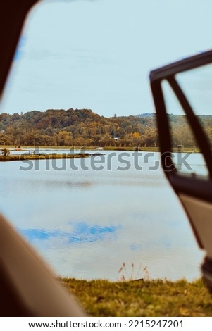 Traveling by car, view from the cabin to the lake and forest, nature and transport
