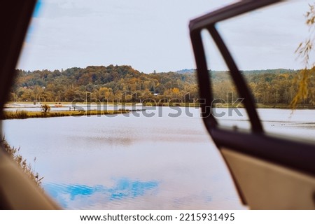 Traveling by car, view from the cabin to the lake and forest, nature and transport