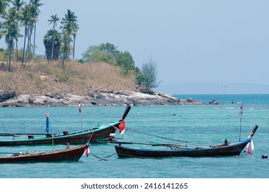 Traveling by Thailand. Beautiful landscape with traditional fishing longtail boats - Powered by Shutterstock