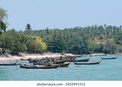 Traveling by Thailand. Beautiful landscape with traditional fishing longtail boats - Powered by Shutterstock