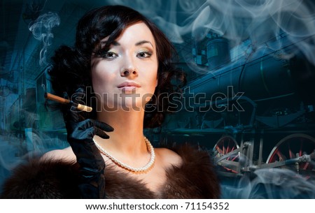 Traveling by train at last century - smoking woman waiting for a train and smokning