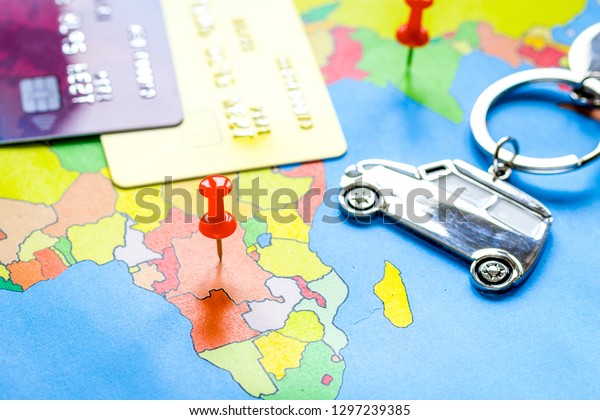 Traveling concept\
with car and credit card on\
map