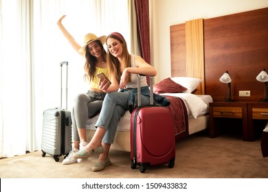 Traveling Girls Resting In A Hotel Room And Having Fun