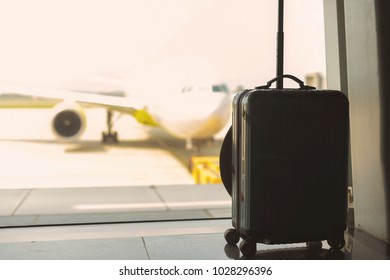 traveling luggage in airport terminal - Shutterstock ID 1028296396