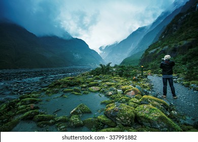 traveling man take a photograph in franz josef glacier important traveler destination in south island new zealand