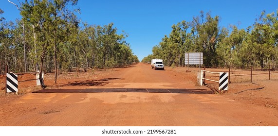 Traveling On A Dirt Road Crossing A Cattle Grid In Northern Territory Border