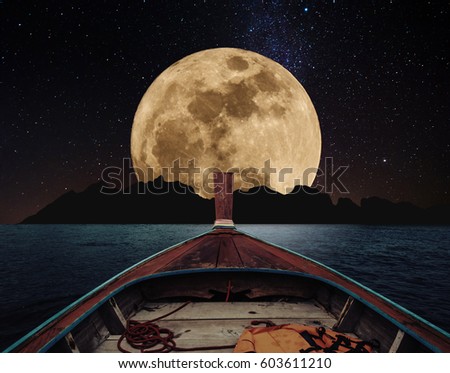 Traveling on wooden boat at night, to the island and full moon with stars