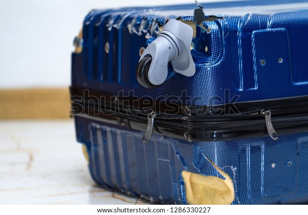 broken wheel on suitcase