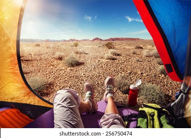 Traveling. Tourism. Tourist tent camping in desert