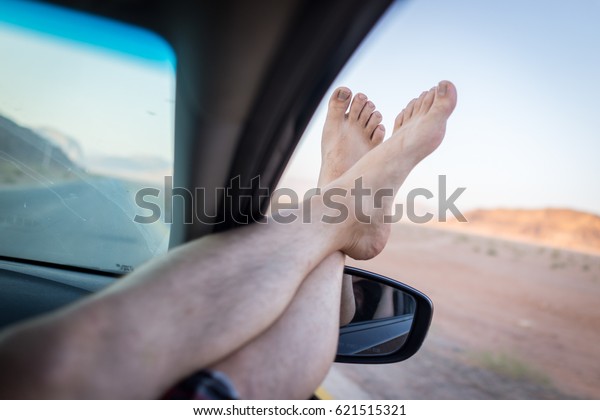 Traveller\
feet in the car concept for having nice\
trip