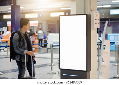 Traveller Man Looking Blank Advertising Billboard At Airport.